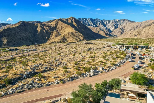 swimming pool view with a seating space