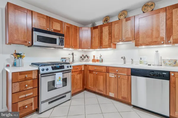 a utility room with sink dryer and washer