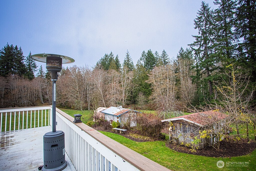 951 Bulman Road Southeast Port Orchard, WA 98366 - Photo 15 of 39 a view of a chair and tables the yard of the house