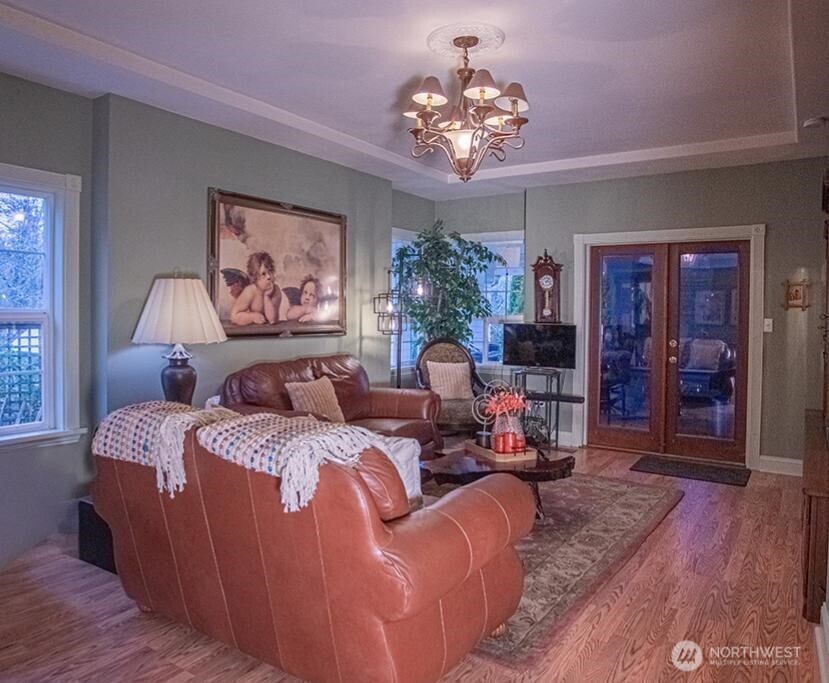 951 Bulman Road Southeast Port Orchard, WA 98366 - Photo 17 of 39 a living room with furniture chandelier and a window