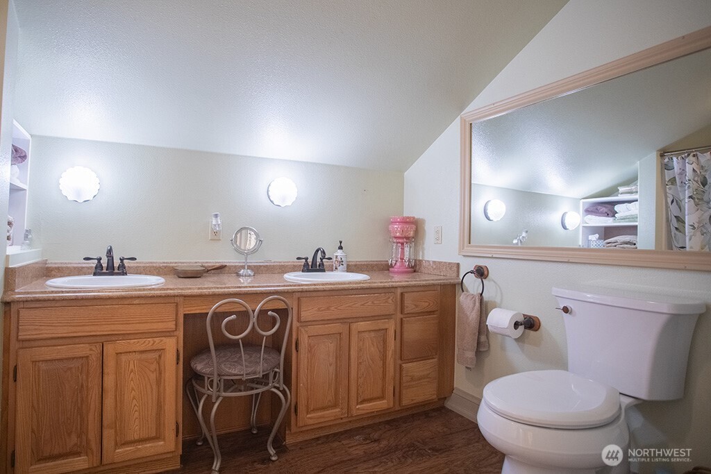 951 Bulman Road Southeast Port Orchard, WA 98366 - Photo 23 of 39 a bathroom with a toilet a sink and mirror