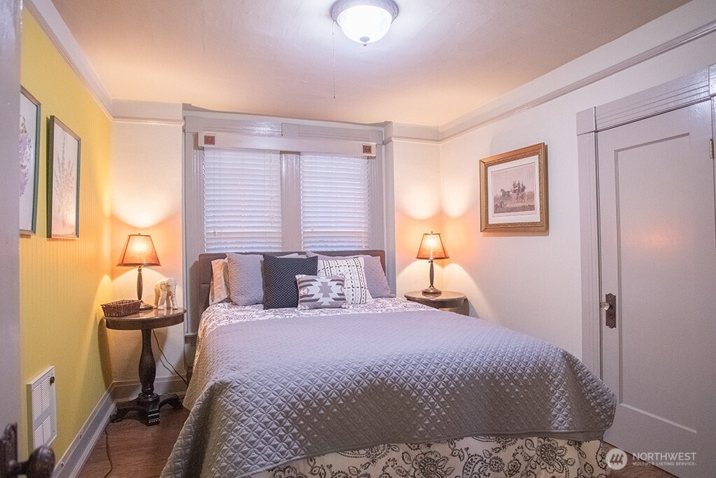 951 Bulman Road Southeast Port Orchard, WA 98366 - Photo 27 of 39 a bedroom with a bed and wooden floor