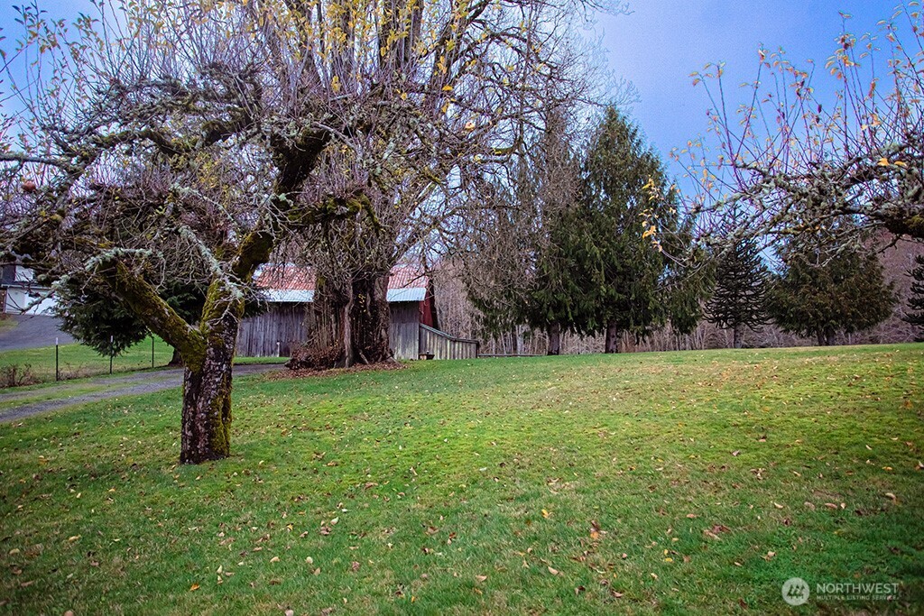 951 Bulman Road Southeast Port Orchard, WA 98366 - Photo 31 of 39 a view of outdoor space with deck and yard