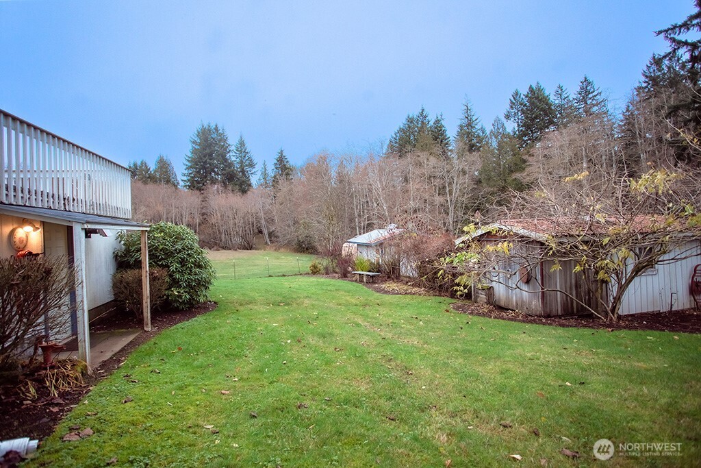 951 Bulman Road Southeast Port Orchard, WA 98366 - Photo 34 of 39 a view of a chair and table in the garden