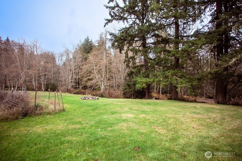 951 Bulman Road Southeast Port Orchard, WA 98366 - Photo 35 of 39 a view of a field with a tree in the background