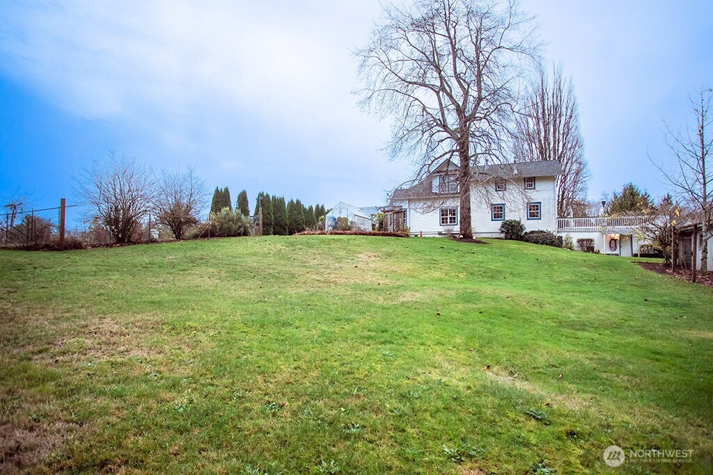 951 Bulman Road Southeast Port Orchard, WA 98366 - Photo 4 of 39 a view of a big yard with a house