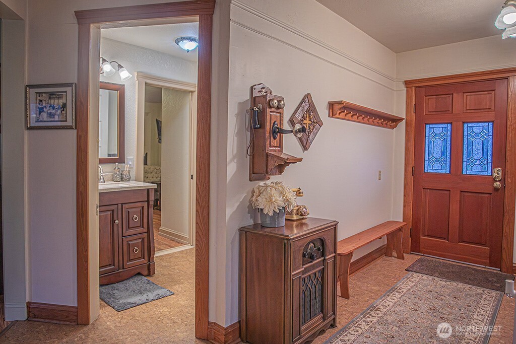951 Bulman Road Southeast Port Orchard, WA 98366 - Photo 6 of 39 a view of a hallway and a livingroom with furniture