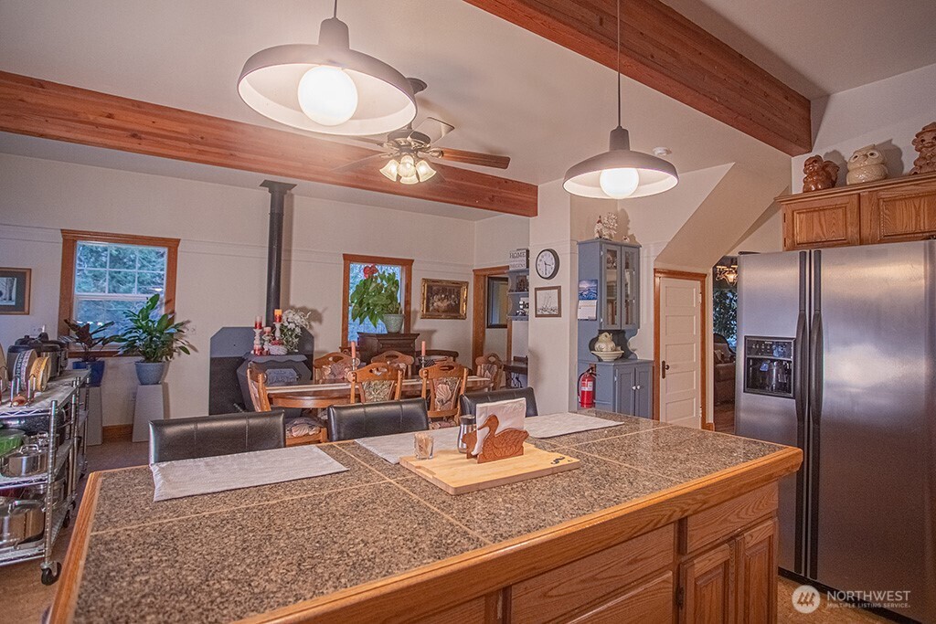 951 Bulman Road Southeast Port Orchard, WA 98366 - Photo 9 of 39 a view of a room with kitchen island stainless steel appliances and living room view