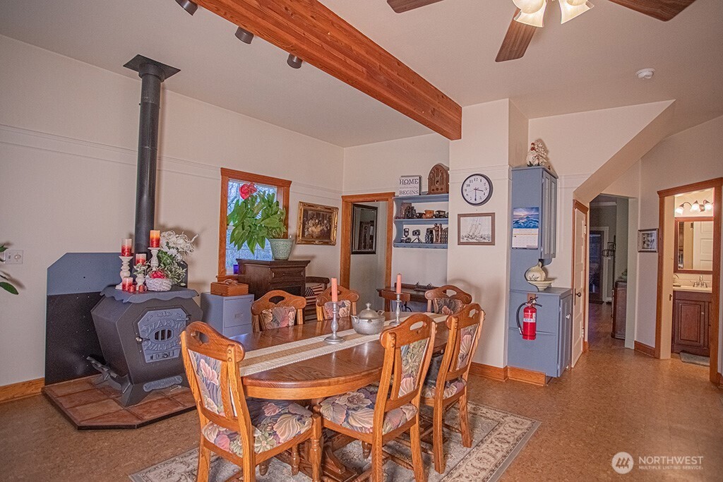 951 Bulman Road Southeast Port Orchard, WA 98366 - Photo 10 of 39 a view of a dining room with furniture and wooden floor