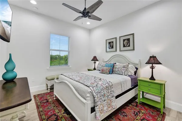 a bed room with a bed and a chair