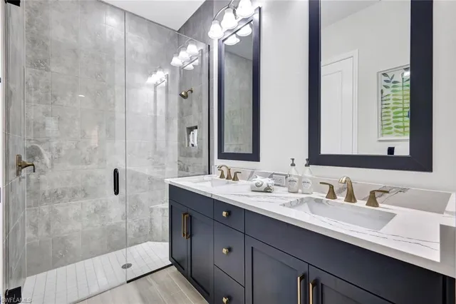 a bathroom with a double vanity sink mirror and double