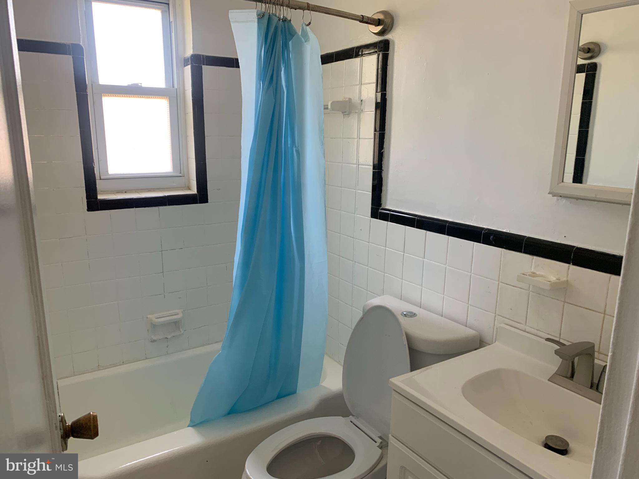 1760 East W Highway Silver Spring, MD 20910 - Photo 11 of 21 a bathroom with a sink and a mirror