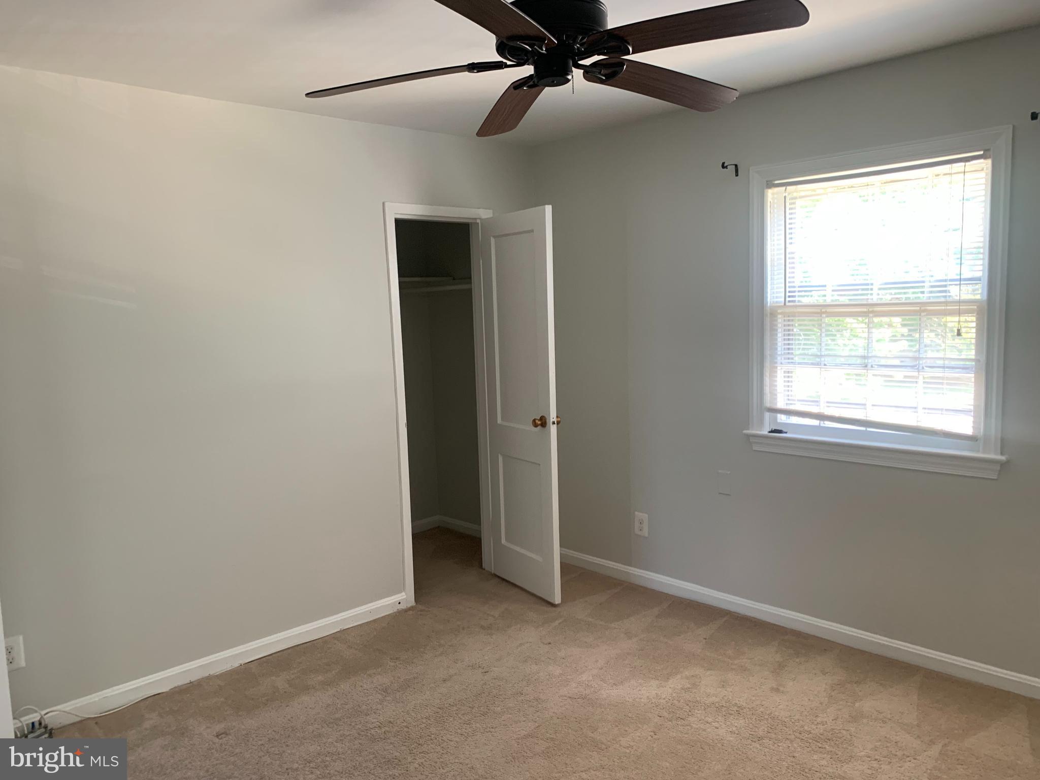 1760 East W Highway Silver Spring, MD 20910 - Photo 17 of 21 an empty room with windows and fan