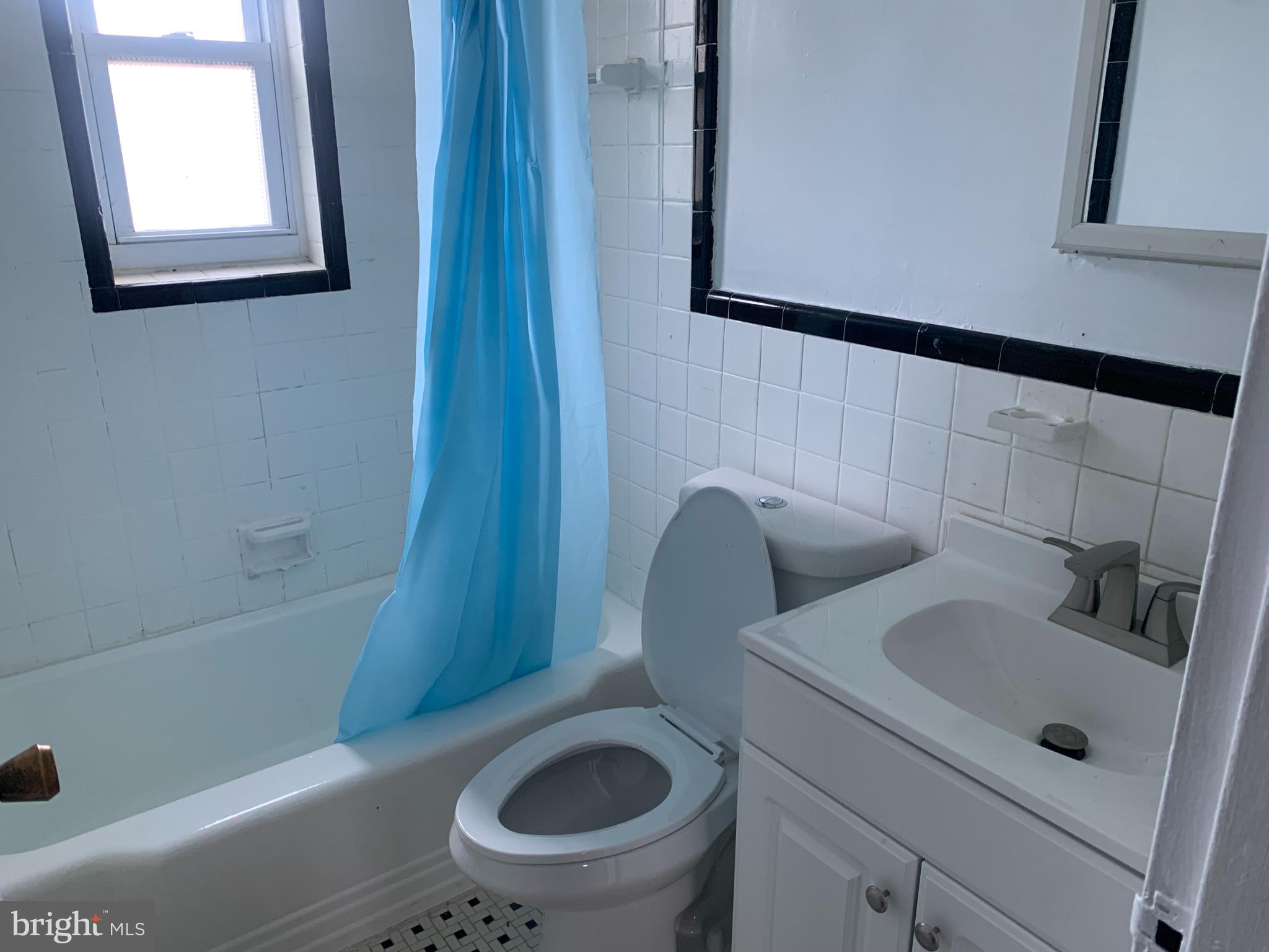 1760 East W Highway Silver Spring, MD 20910 - Photo 19 of 21 a bathroom with a sink a toilet and bathtub