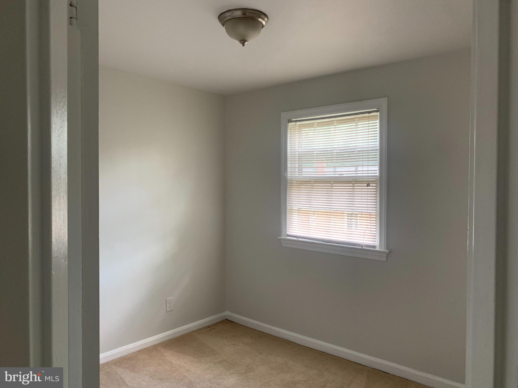 1760 East W Highway Silver Spring, MD 20910 - Photo 20 of 21 an empty room with a window