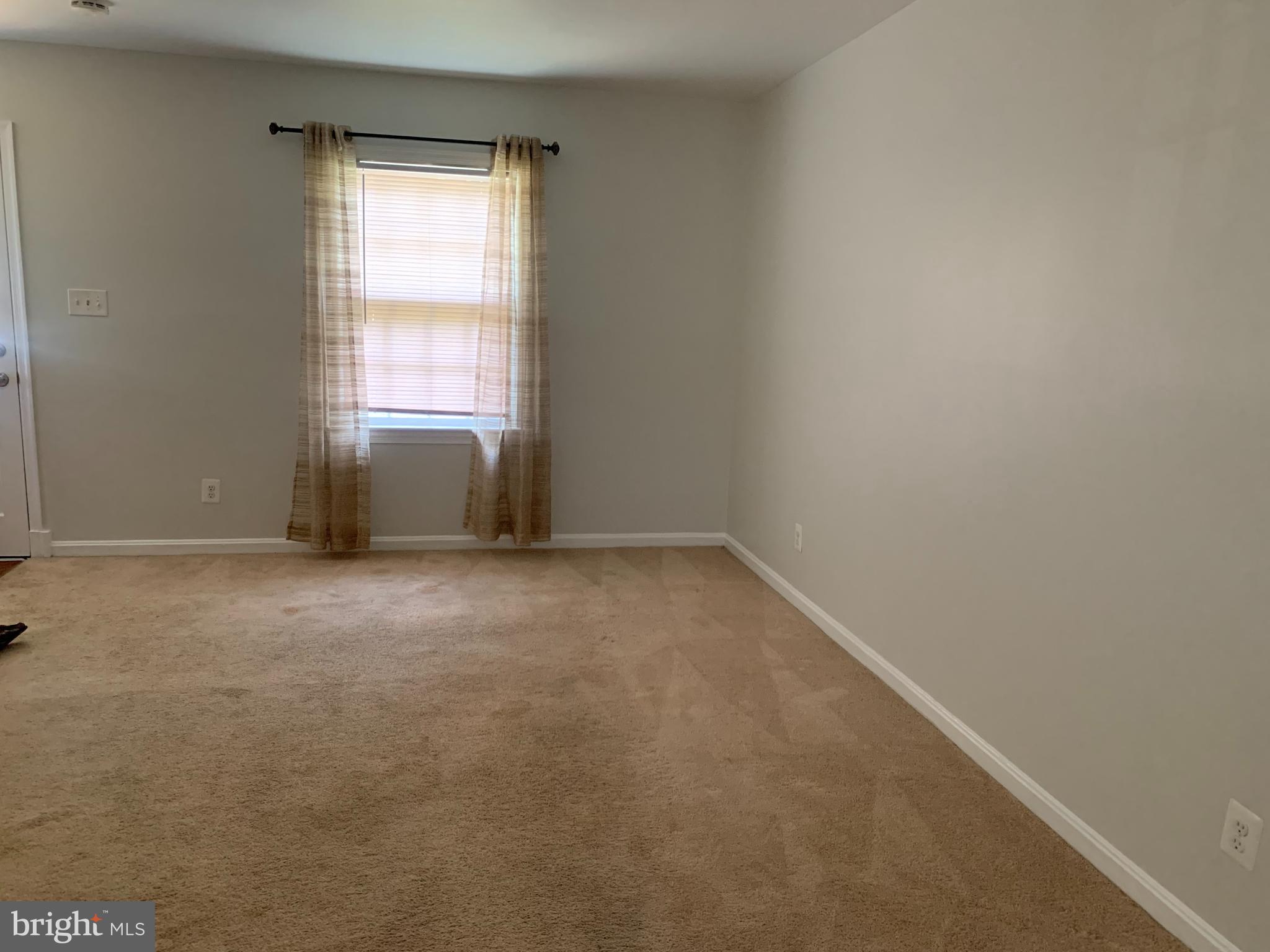 1760 East W Highway Silver Spring, MD 20910 - Photo 6 of 21 a view of an empty room with a window