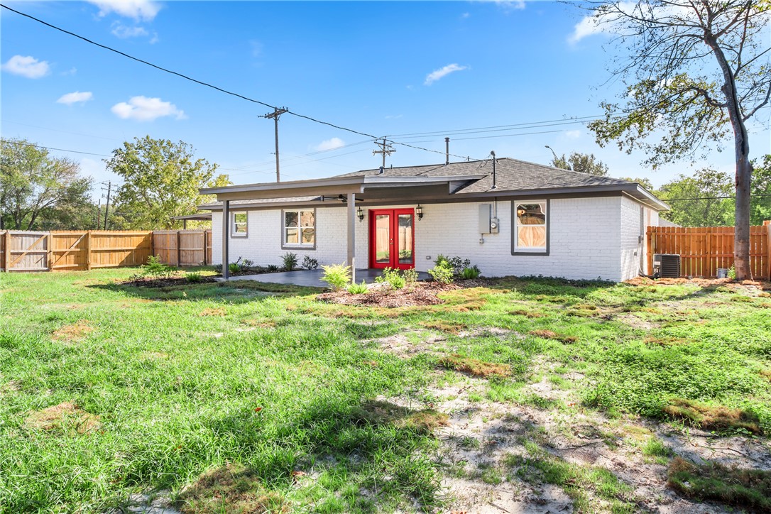 3004 Woodville Road Bryan, TX 77803 - Photo 20 of 26 a front view of house with yard and green space