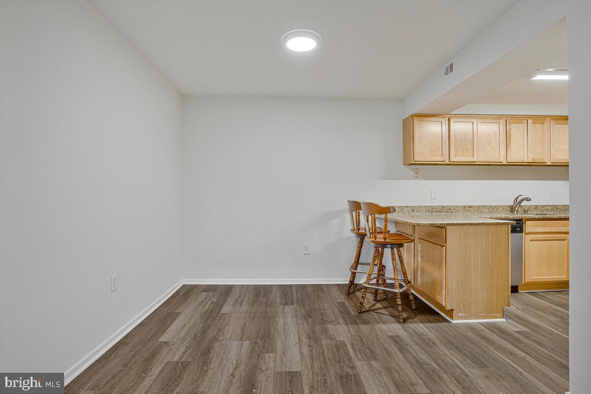 2574 Riva Road, Unit 19A Annapolis, MD 21401 - Photo 4 of 35 a view of a room with wooden floor and pool table