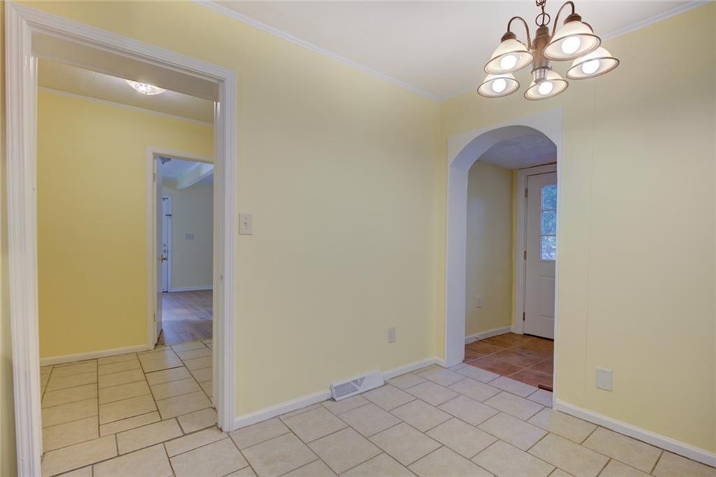 9174 Flat Shoals Road Southwest Covington, GA 30014 - Photo 11 of 25 an empty room and hallway