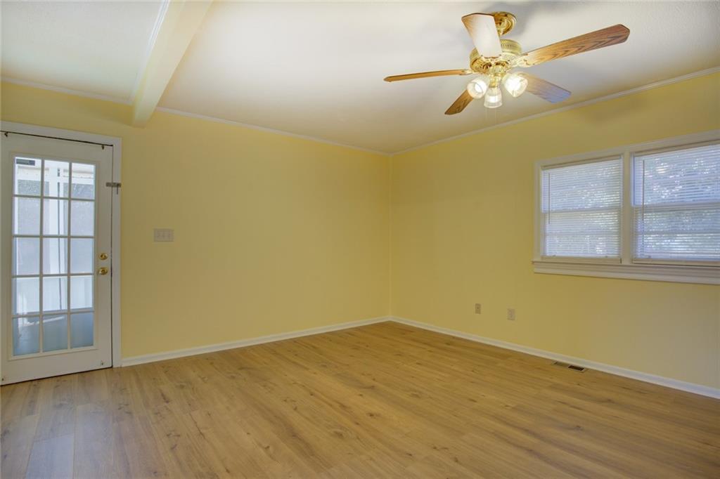 9174 Flat Shoals Road Southwest Covington, GA 30014 - Photo 15 of 25 an empty room with a window and a fan