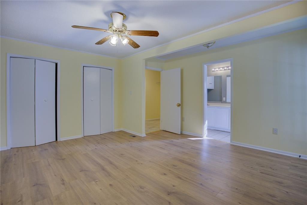 9174 Flat Shoals Road Southwest Covington, GA 30014 - Photo 16 of 25 a view of an empty room with wooden floor