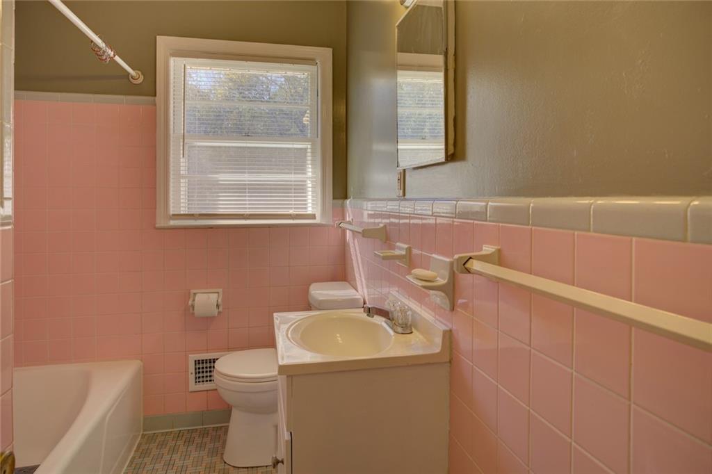 9174 Flat Shoals Road Southwest Covington, GA 30014 - Photo 23 of 25 a bathroom with a sink and a toilet