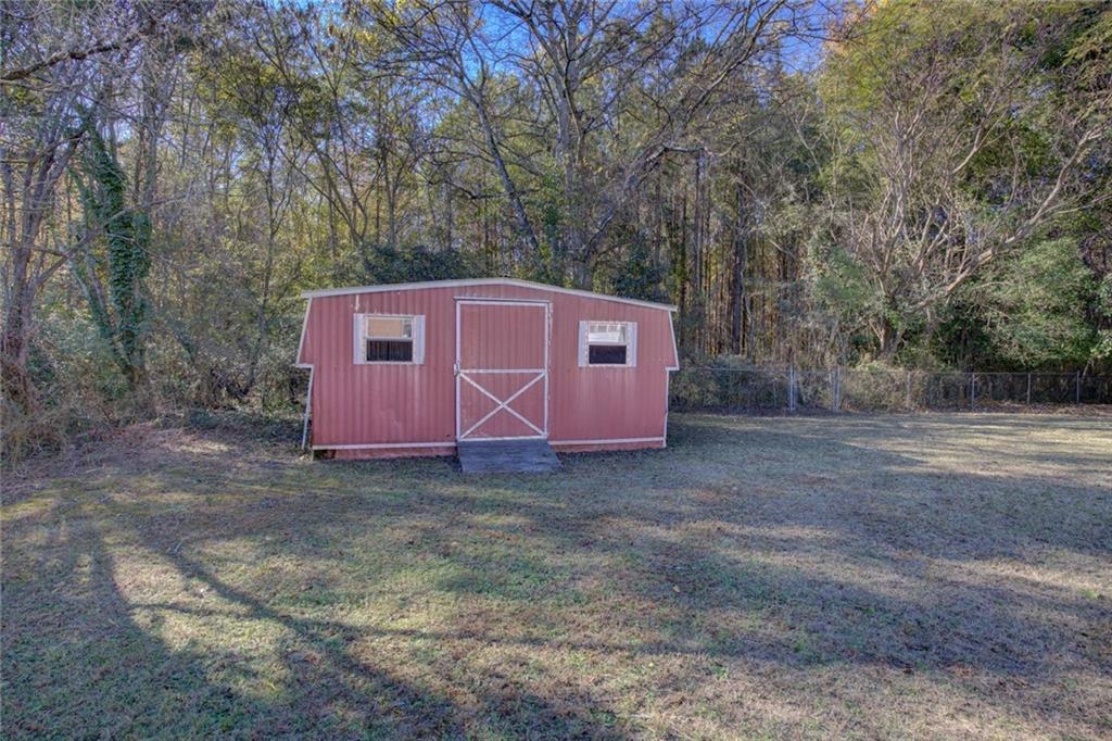 9174 Flat Shoals Road Southwest Covington, GA 30014 - Photo 25 of 25 a view of a backyard