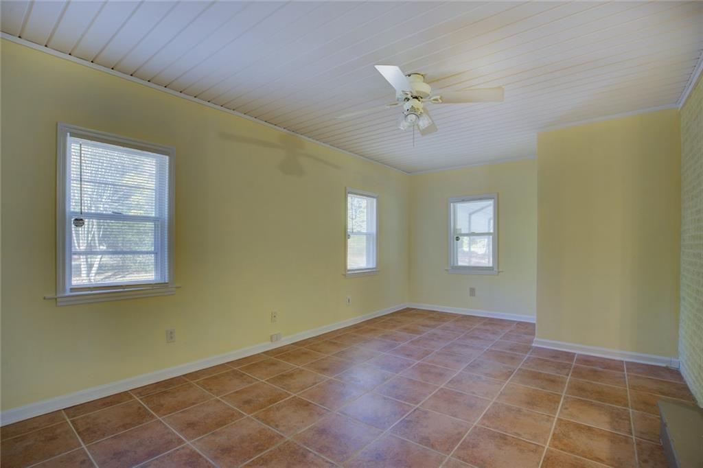 9174 Flat Shoals Road Southwest Covington, GA 30014 - Photo 7 of 25 a view of an empty room with a window