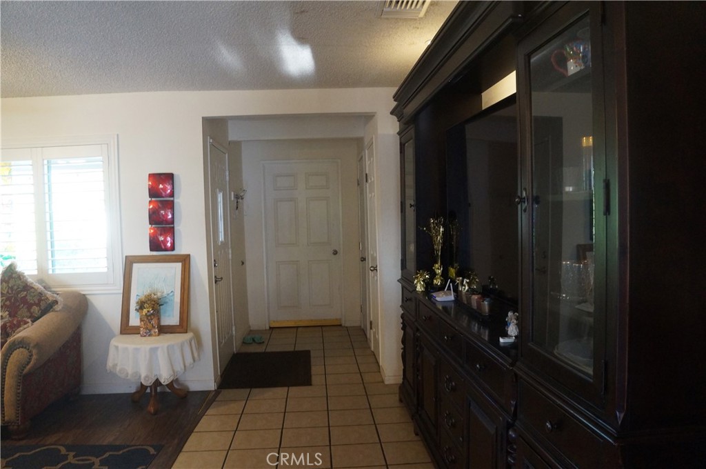 9442 Placer Street Rancho Cucamonga, CA 91730 - Photo 13 of 40 a hallway with kids room bathroom