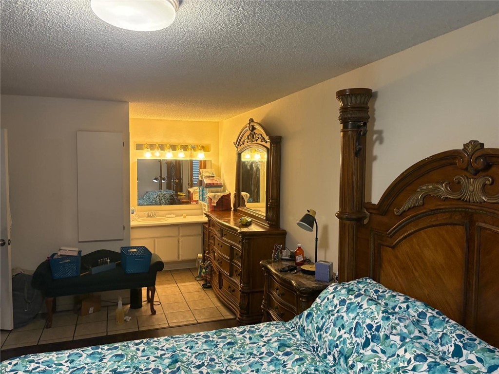 9442 Placer Street Rancho Cucamonga, CA 91730 - Photo 18 of 40 a room with furniture a rug and a window