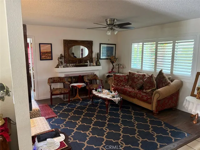 a living room with furniture and a rug