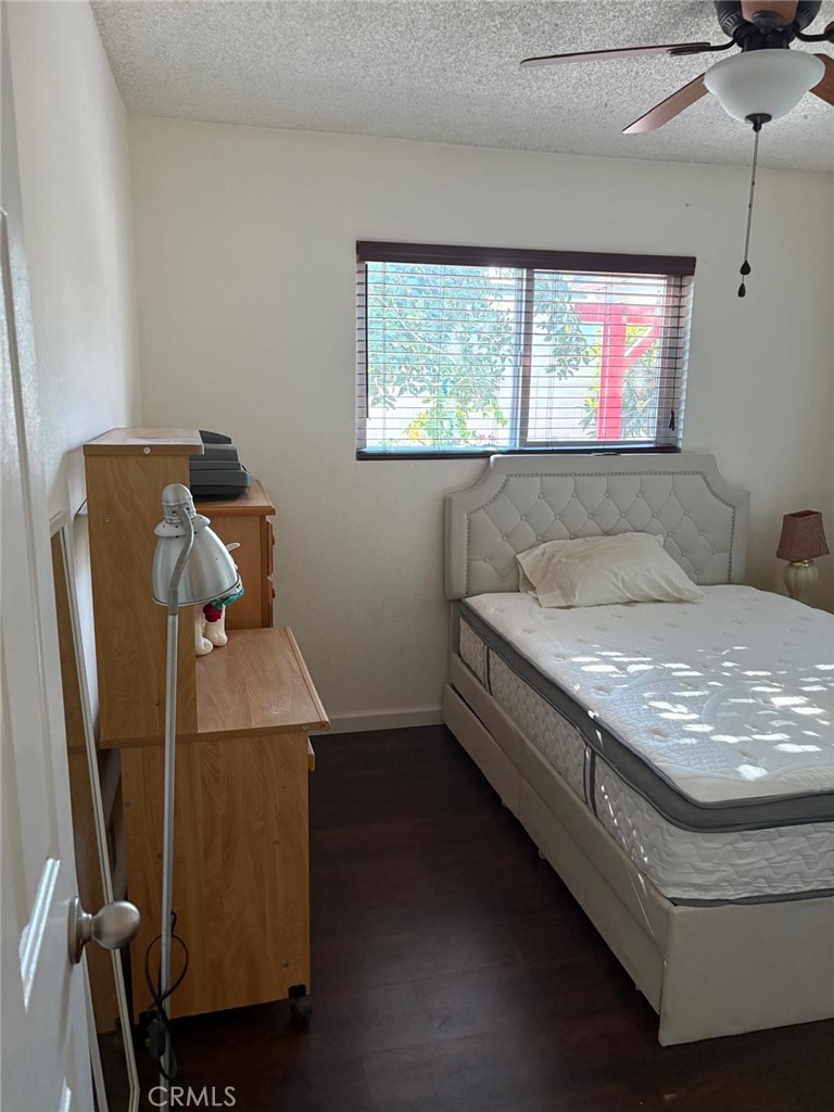 9442 Placer Street Rancho Cucamonga, CA 91730 - Photo 24 of 40 a living room with a couch and a window