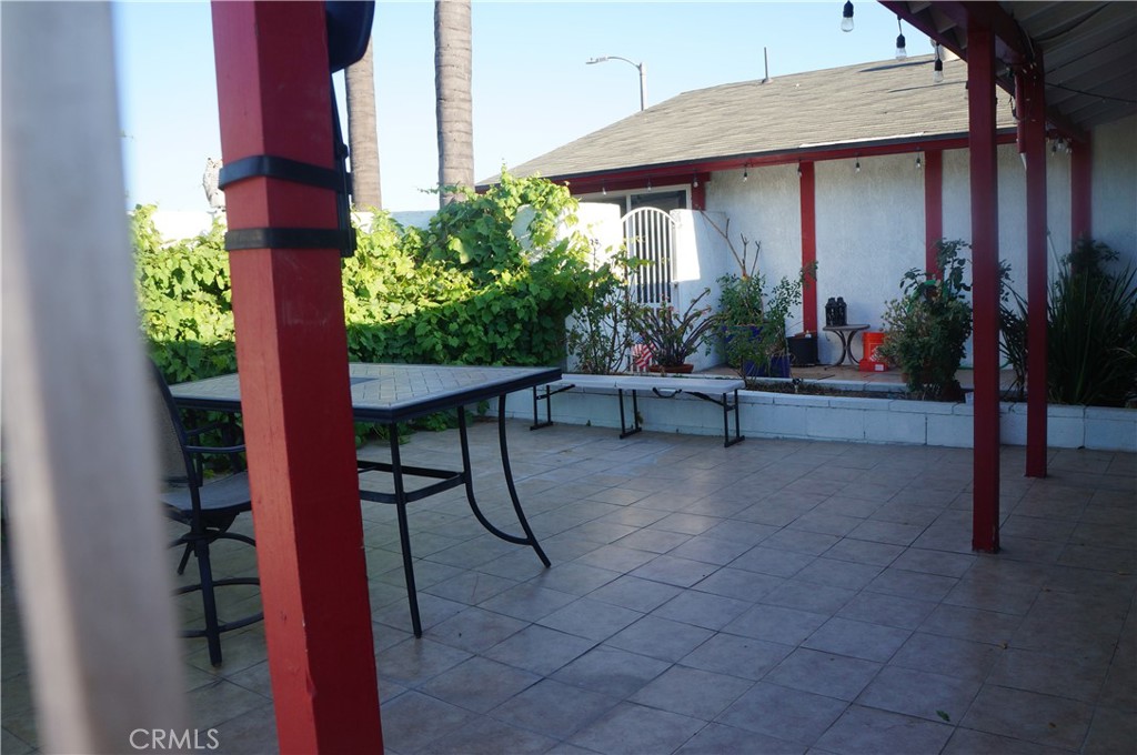 9442 Placer Street Rancho Cucamonga, CA 91730 - Photo 30 of 40 a view of a porch with furniture and next to a yard