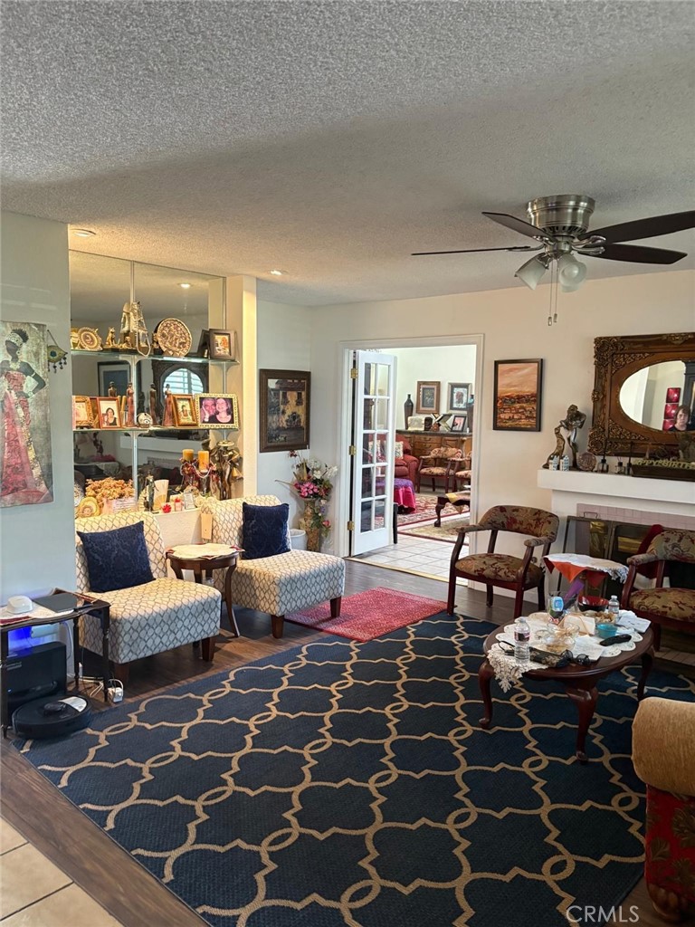 9442 Placer Street Rancho Cucamonga, CA 91730 - Photo 3 of 40 a living room with furniture and a flat screen tv