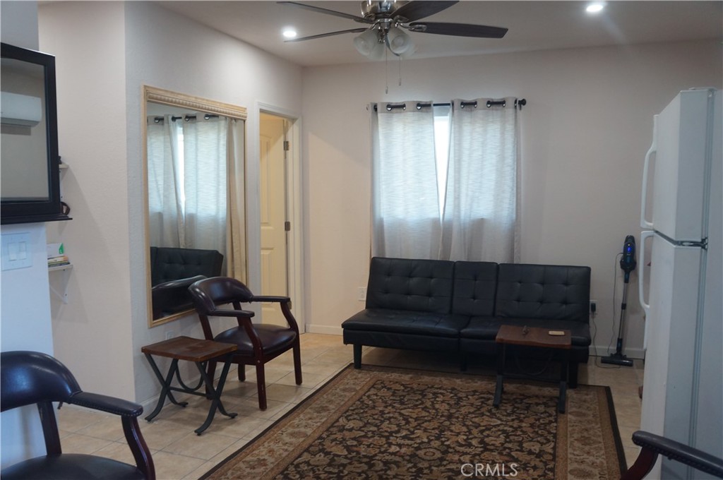 9442 Placer Street Rancho Cucamonga, CA 91730 - Photo 39 of 40 a living room with furniture and a gate