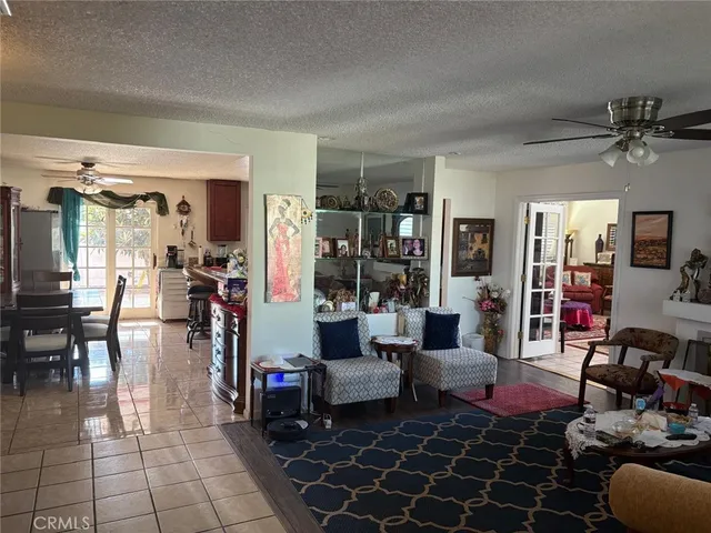 a living room with lots of furniture and white walls