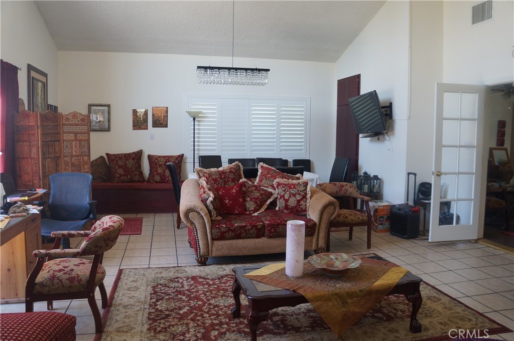 9442 Placer Street Rancho Cucamonga, CA 91730 - Photo 6 of 40 a living room with furniture wooden floor and a fireplace