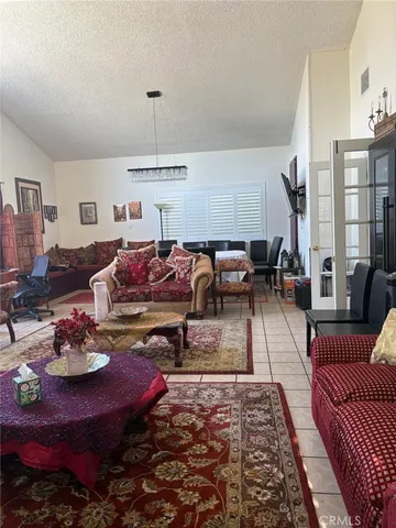 a living room with furniture fireplace and rug