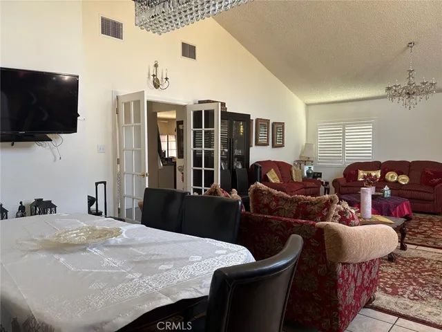 a bedroom with furniture and flat screen tv