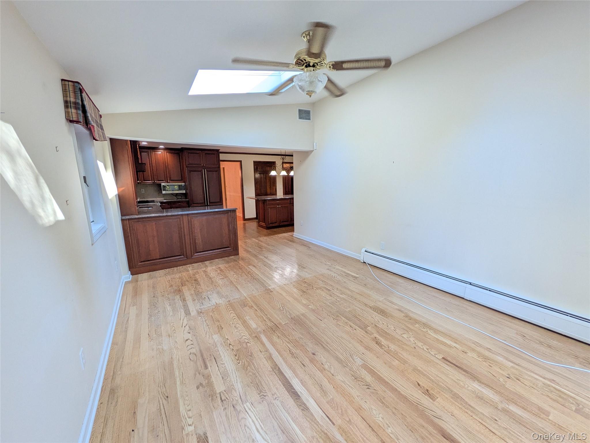 31 Mile Road Suffern, NY 10901 - Photo 12 of 32 a view of a kitchen with a sink cabinet a ceiling fan and wooden floor