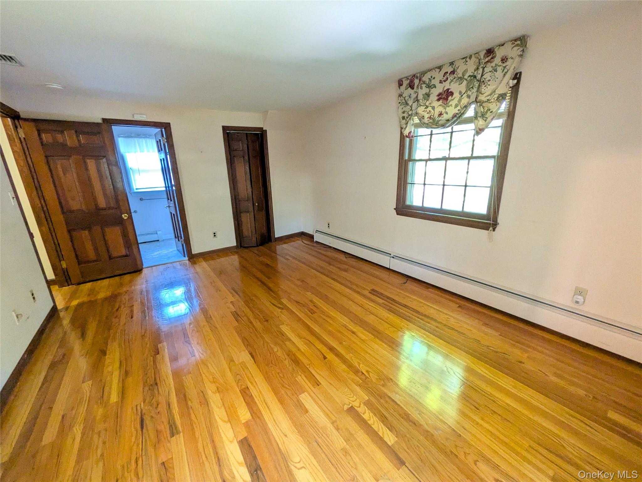31 Mile Road Suffern, NY 10901 - Photo 18 of 32 a view of an empty room with wooden floor and a window
