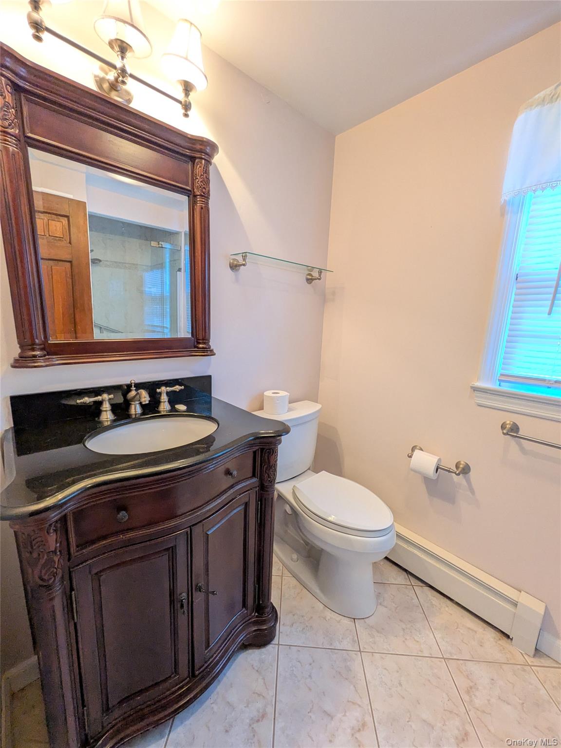 31 Mile Road Suffern, NY 10901 - Photo 20 of 32 a bathroom with a granite countertop toilet sink and mirror