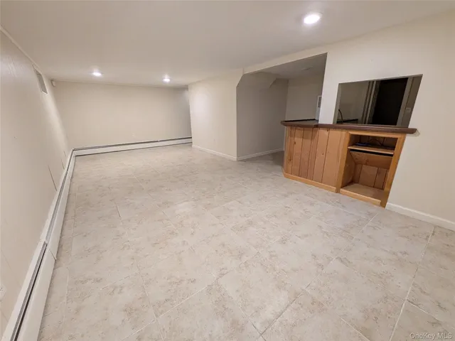 a view of kitchen with stainless steel appliances cabinets