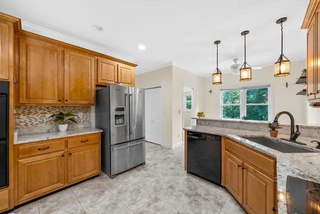 a view of storage and utility room with window