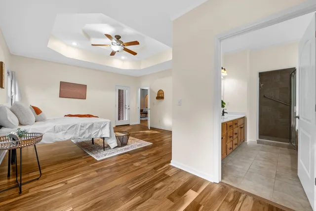 a bathroom with bathtub and window