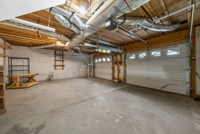 a view of a deck with wooden floor and barbeque oven