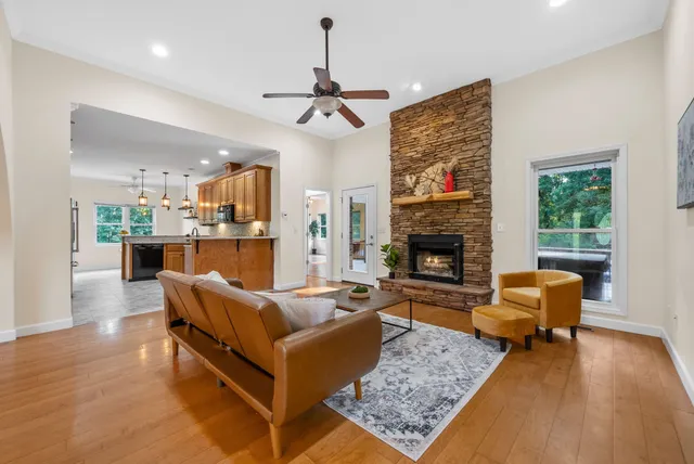 a living room with furniture and a fireplace