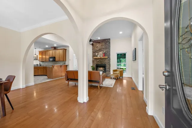 a dining room with furniture a window and a chandelier