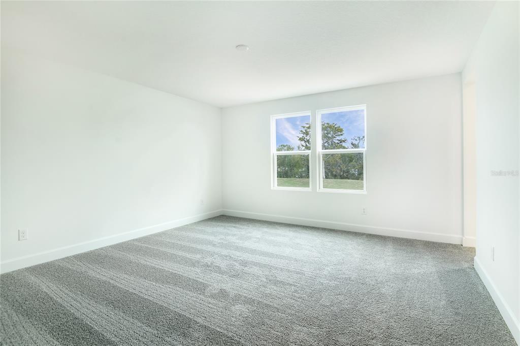 158 Waterstone Loop Tavares, FL 32778 - Photo 11 of 20 an empty room with windows