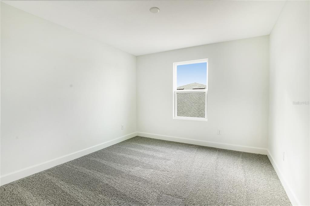 158 Waterstone Loop Tavares, FL 32778 - Photo 15 of 20 a view of an empty room with a window